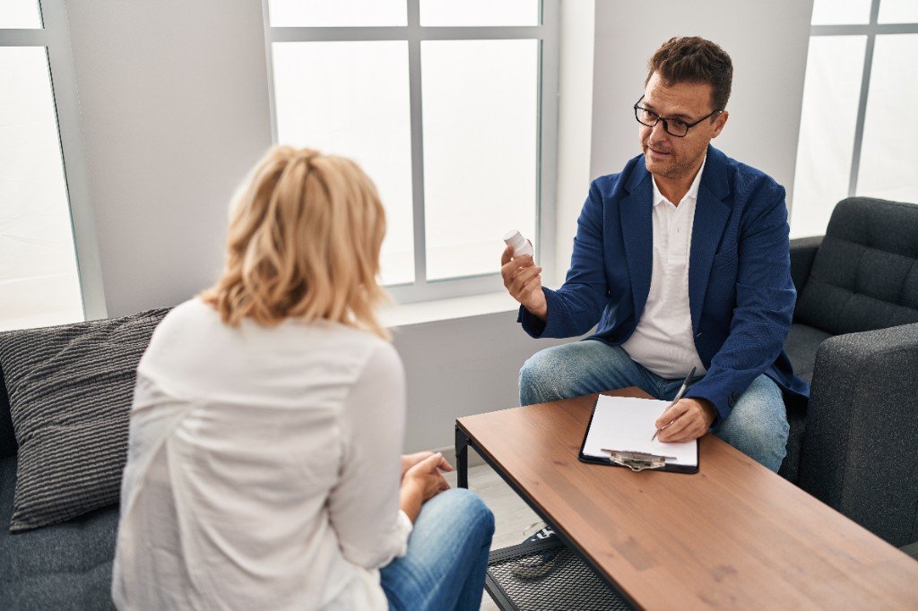 Clinician explaining medication during a consultation